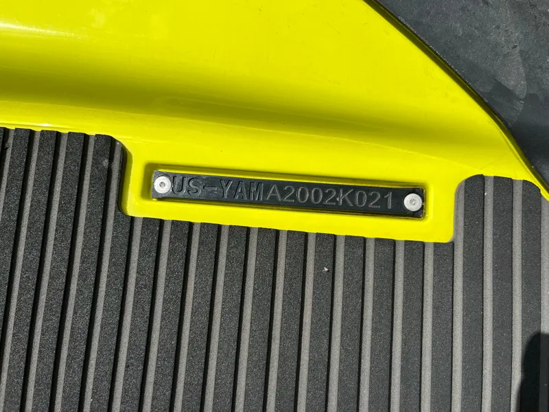Slide: The Image of 2021 Yamaha WaveRunner VX Cruiser HO identification plate on yellow and black surface. - 7