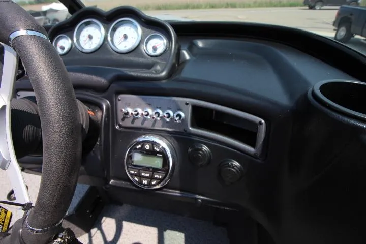 Slide: The Image of Dashboard of 2025 Lund 1875 Crossover XS boat with steering wheel and gauges. - 4