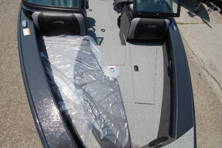 Slide: The Image of 2025 Lund 1875 Crossover XS boat interior with protective plastic covering. - 7