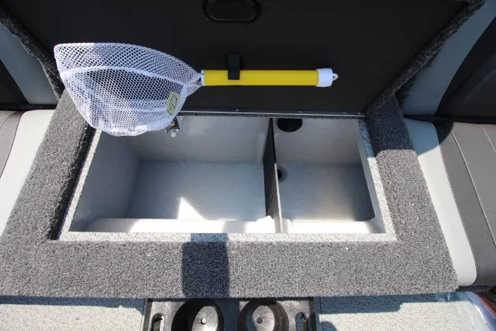 Slide: The Image of 2025 Lund 1875 Crossover XS storage compartment with fishing net and cup holders. - 8