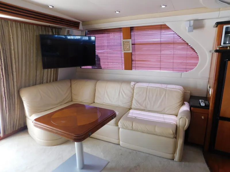 Slide: The Image of Luxurious interior of 2002 Carver 450 Voyager Pilothouse with leather seating and mounted TV. - 15