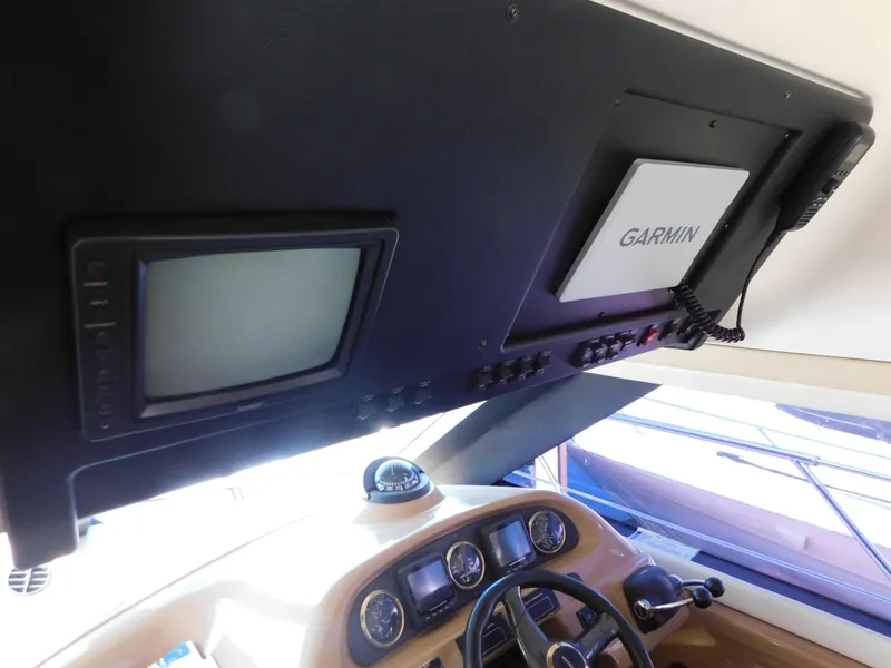 Slide: The Image of Interior of 2002 Carver 450 Voyager Pilothouse with Garmin navigation system. - 18