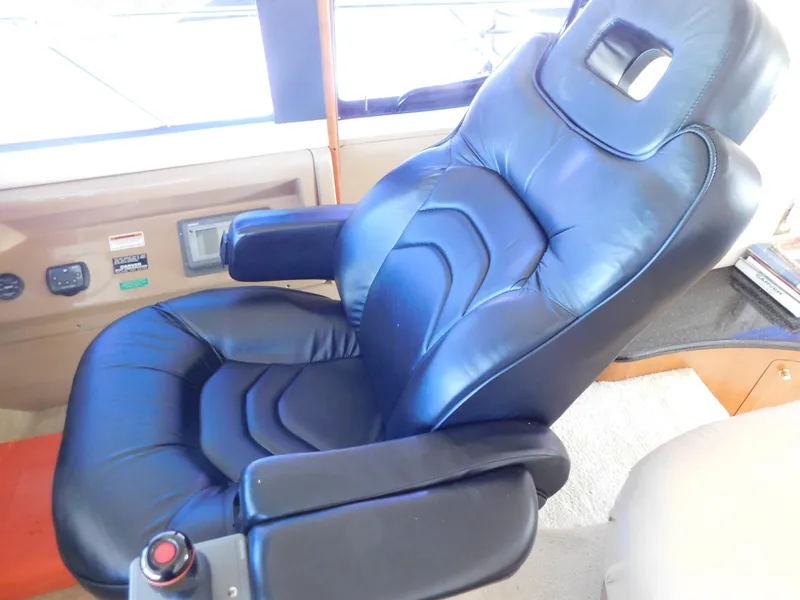 Slide: The Image of Luxurious black leather captain's chair in 2002 Carver 450 Voyager Pilothouse. - 20