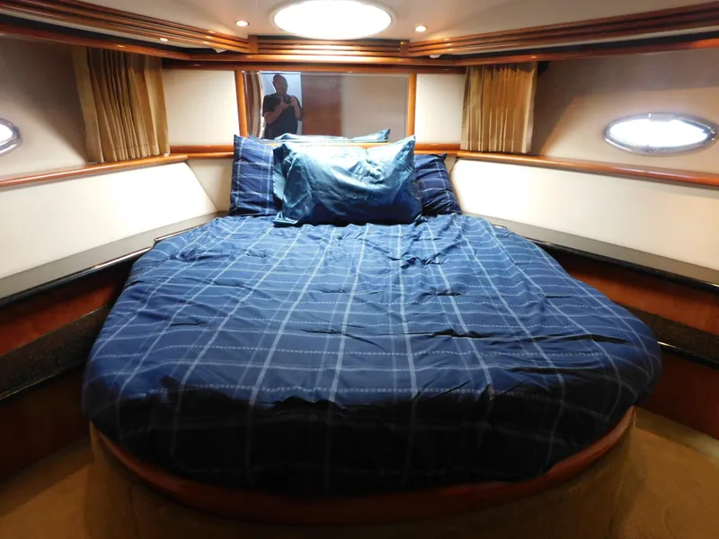 Slide: The Image of Luxurious bedroom in 2002 Carver 450 Voyager Pilothouse yacht with blue bedding. - 23