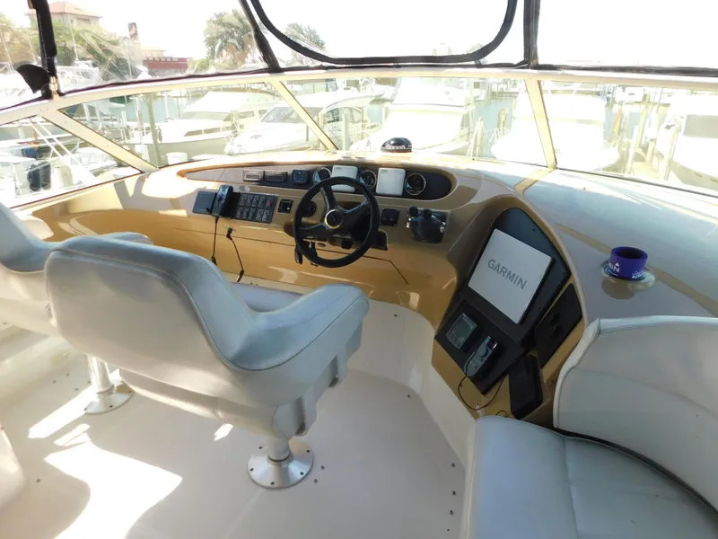 Slide: The Image of Pilothouse interior of 2002 Carver 450 Voyager with Garmin navigation system and dual captain chairs. - 28