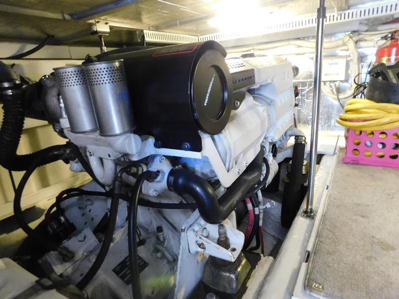 Slide: The Image of Engine room of 2002 Carver 450 Voyager Pilothouse with visible machinery and equipment. - 37