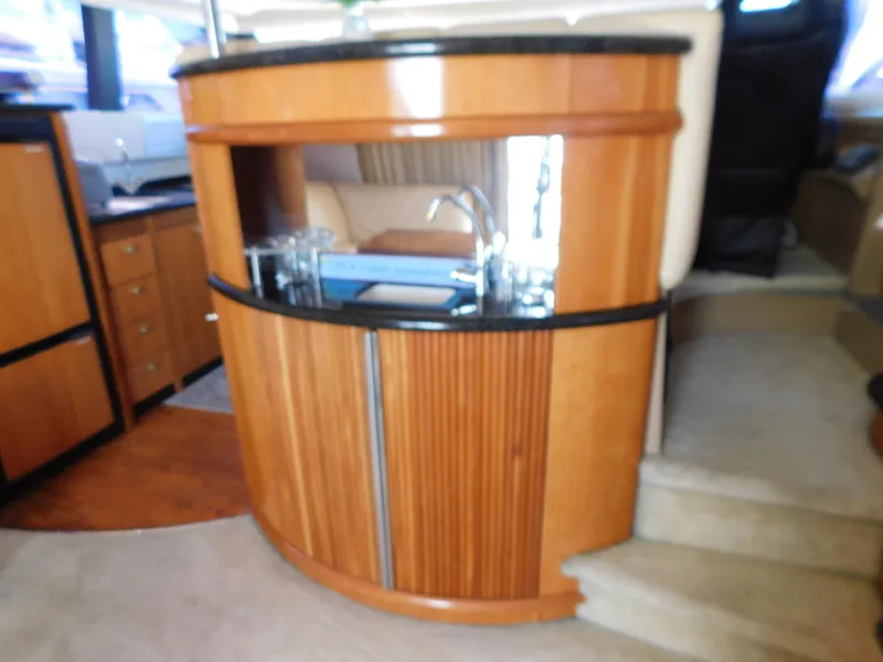 Slide: The Image of Luxurious interior of 2002 Carver 450 Voyager Pilothouse with wooden cabinetry and modern amenities. - 13