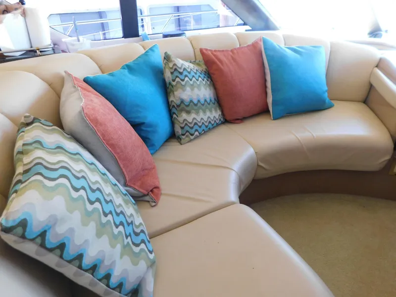 Slide: The Image of Luxurious beige seating with colorful cushions on a 2002 Carver 450 Voyager Pilothouse yacht. - 17