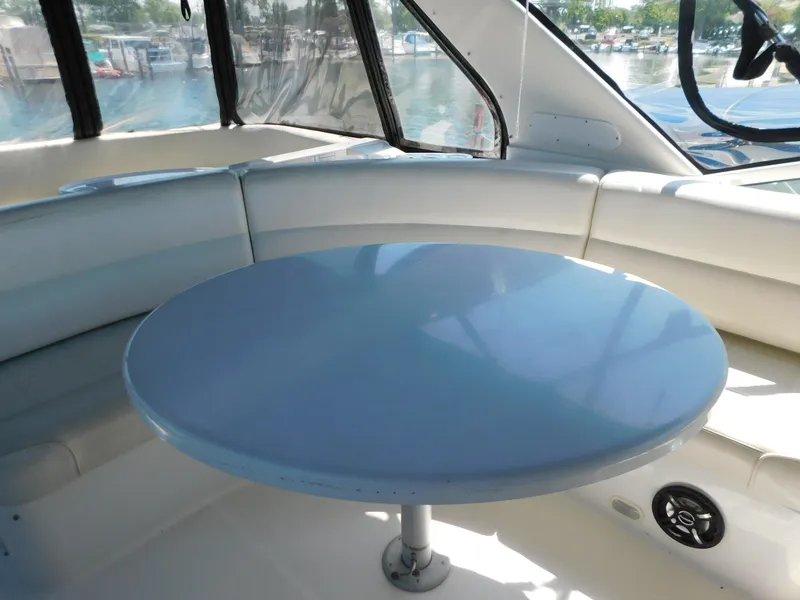 Slide: The Image of Interior of 2002 Carver 450 Voyager Pilothouse with round table and seating. - 30