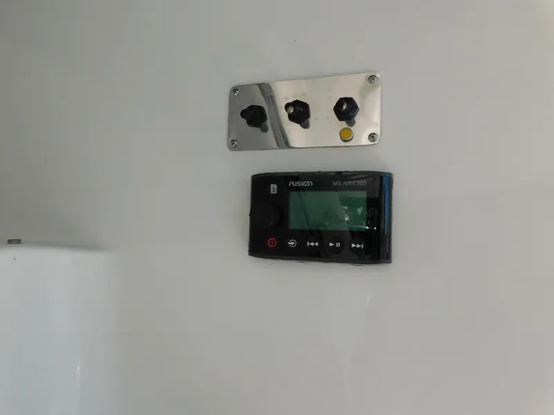 Slide: The Image of Control panel and Fusion MS-NRX300 on 2002 Carver 450 Voyager Pilothouse. - 35