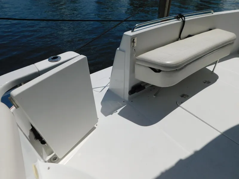 Slide: The Image of 2002 Carver 450 Voyager Pilothouse deck with seating and storage compartments. - 8