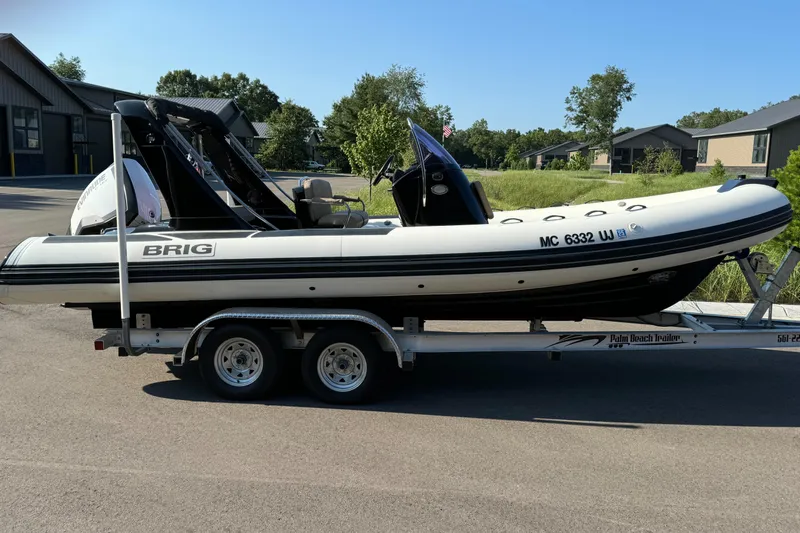 The Image of 2019 Brig Eagle 650 boat on trailer, parked outdoors, sunny day. - 0