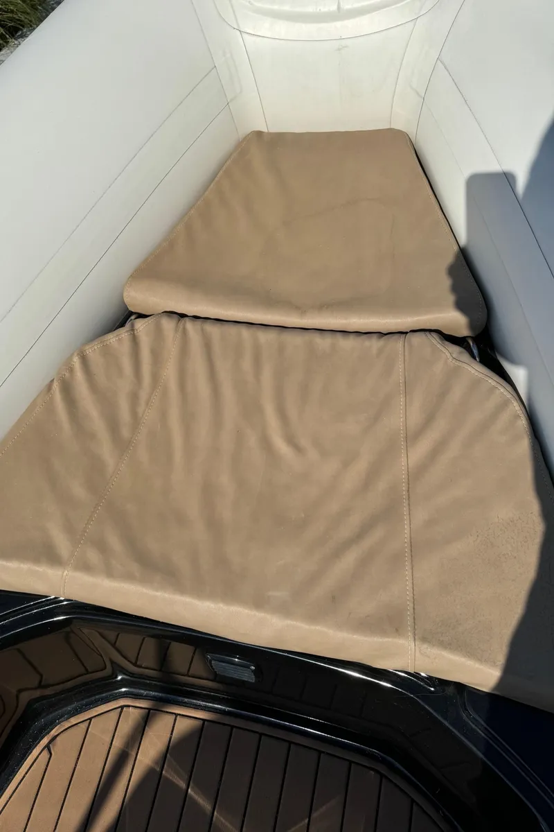 Slide: The Image of 2019 Brig Eagle 650 boat with beige cushioned seating and white interior. - 12