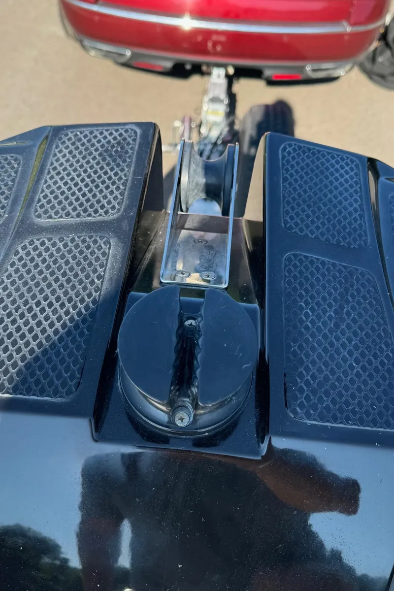 Slide: The Image of 2019 Brig Eagle 650 boat trailer hitch close-up with red vehicle in background. - 15