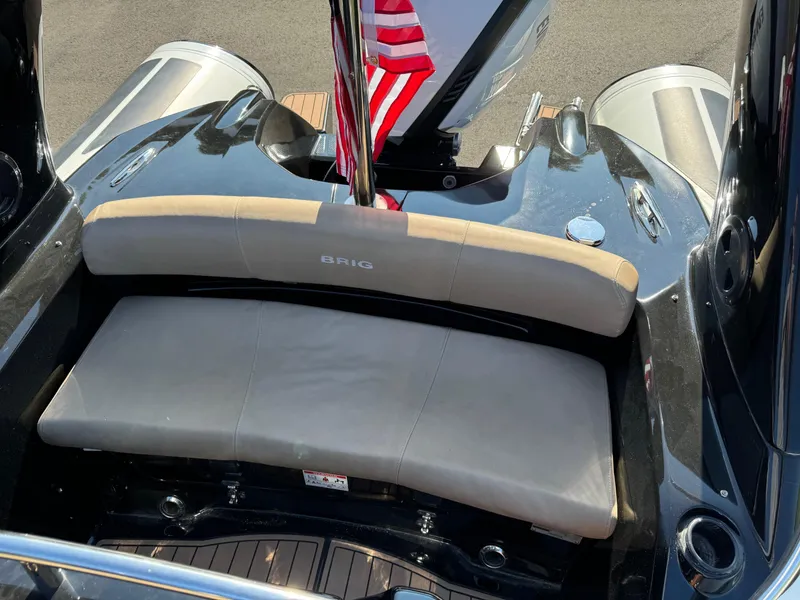 Slide: The Image of 2019 Brig Eagle 650 boat with beige seating and American flag. - 24