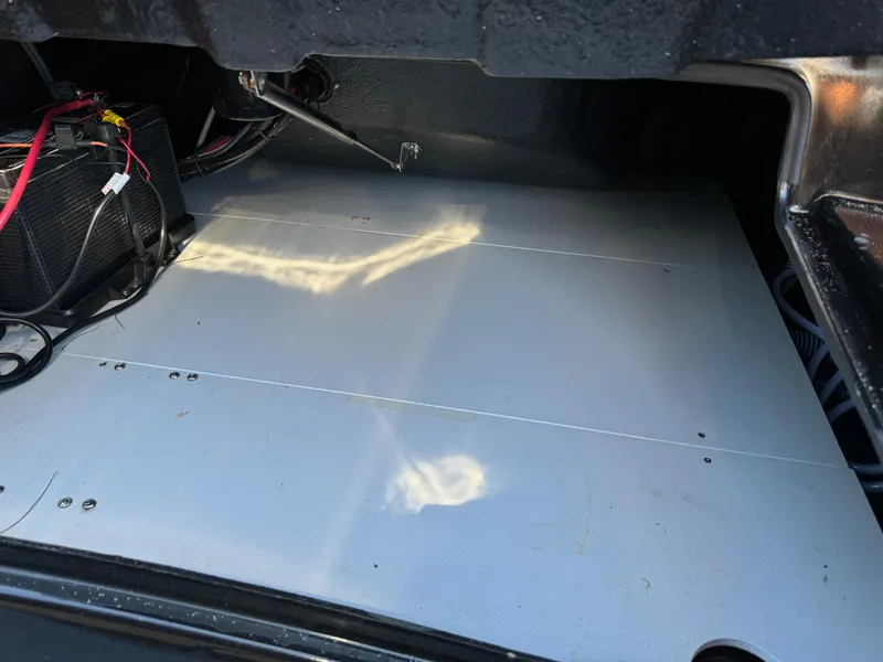 Slide: The Image of 2019 Brig Eagle 650 boat interior showing battery and wiring setup. - 27