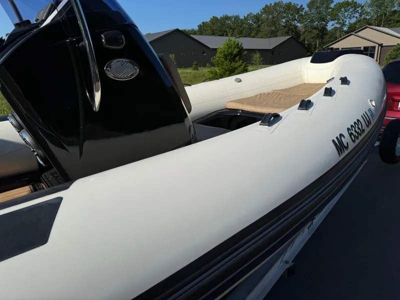 Slide: The Image of 2019 Brig Eagle 650 inflatable boat with sleek design, docked outdoors. - 3