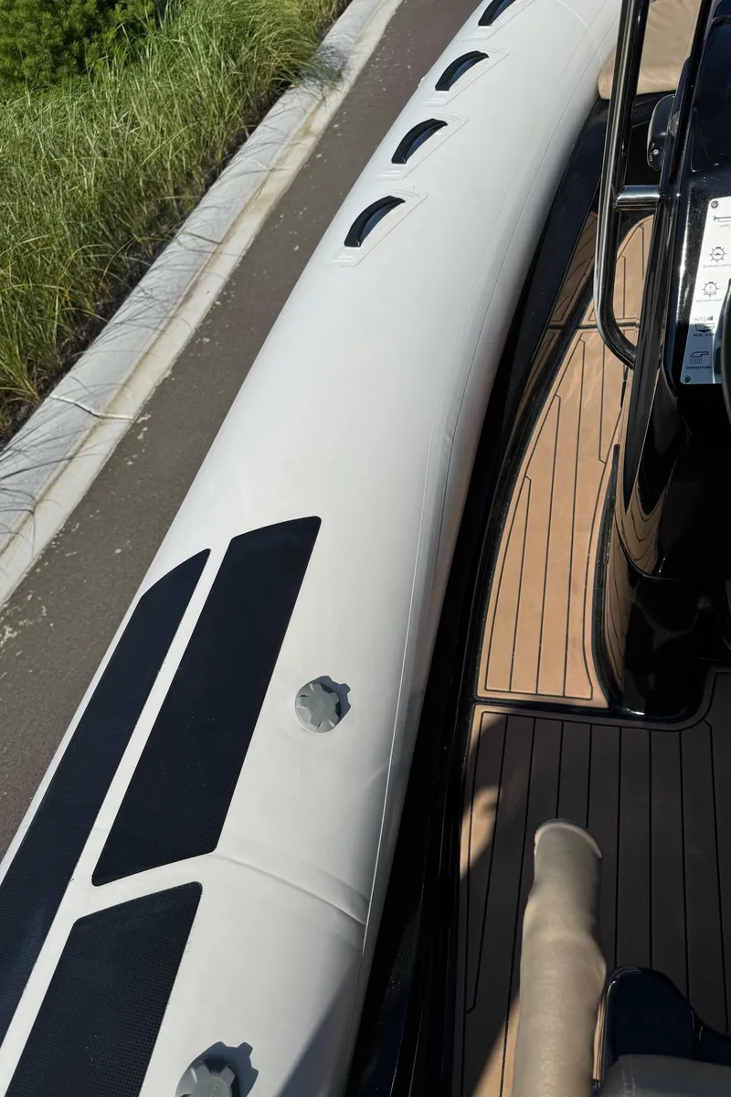 Slide: The Image of 2019 Brig Eagle 650 boat with sleek design and wooden deck. - 40
