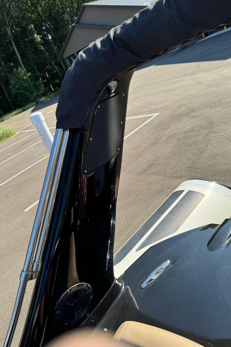 Slide: The Image of 2019 Brig Eagle 650 boat detail with sleek black design and outdoor setting. - 43