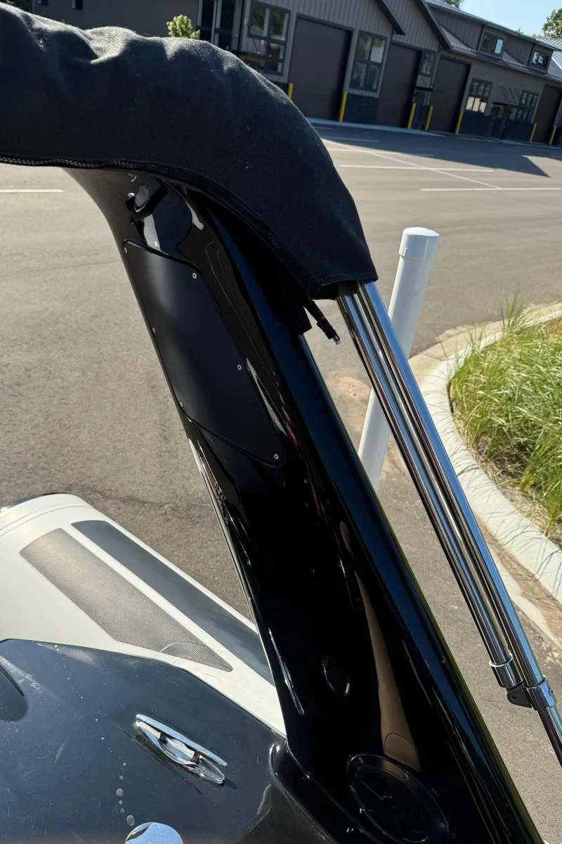 Slide: The Image of Close-up of a 2019 Brig Eagle 650 boat's sleek black frame and chrome details. - 44