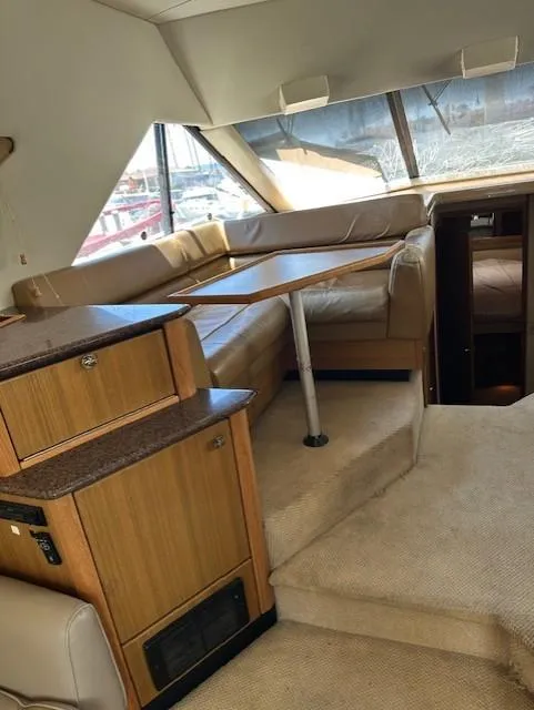 Slide: The Image of Interior of 2002 Bayliner 3988 Command Bridge Motoryacht with seating and table. - 12