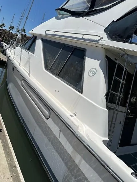 Slide: The Image of 2002 Bayliner 3988 Command Bridge Motoryacht docked at marina. - 19