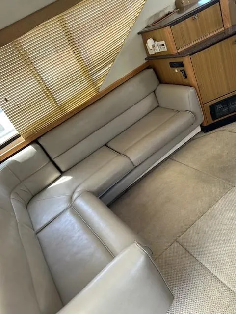 Slide: The Image of Luxurious interior of 2002 Bayliner 3988 Command Bridge Motoryacht with beige leather seating. - 2