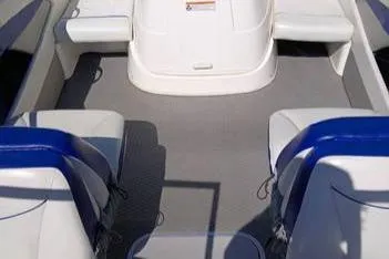 Slide: The Image of 2007 Bayliner 195 boat interior with white and blue seating. - 6