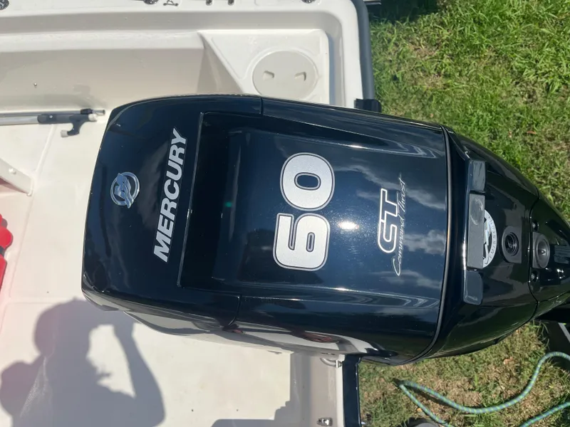 Slide: The Image of Mercury 60 CT outboard motor on 2025 Boston Whaler 150 Montauk boat. - 11