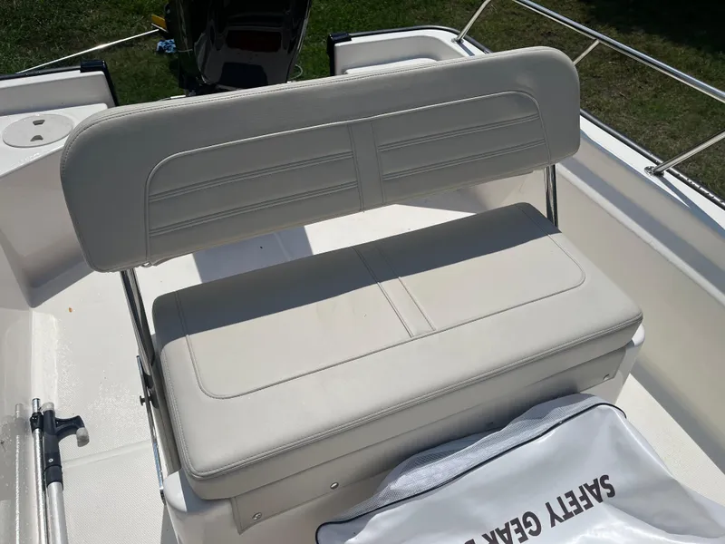 Slide: The Image of 2025 Boston Whaler 150 Montauk boat seat with safety gear bag. - 12