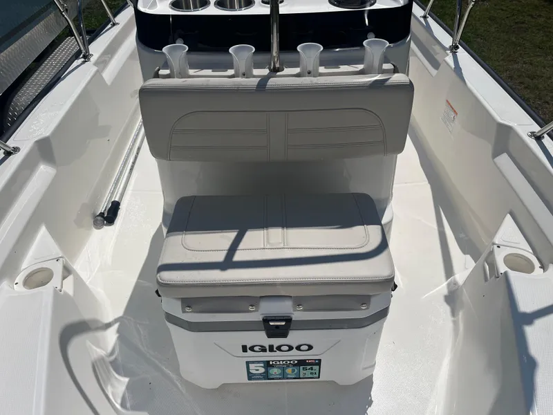 Slide: The Image of 2025 Boston Whaler 150 Montauk interior with Igloo cooler and seating. - 6