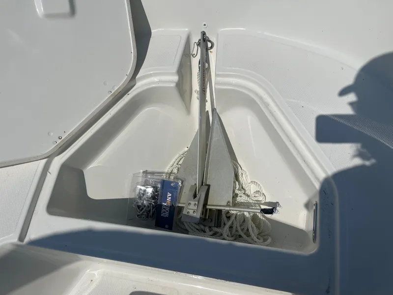 Slide: The Image of Anchor storage compartment on 2025 Boston Whaler 150 Montauk boat. - 8