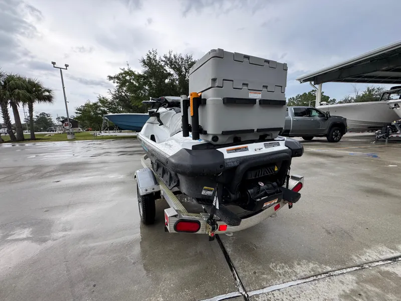 Slide: The Image of 2022 Sea-Doo Fish Pro Scout on trailer, parked outdoors on wet pavement. - 11