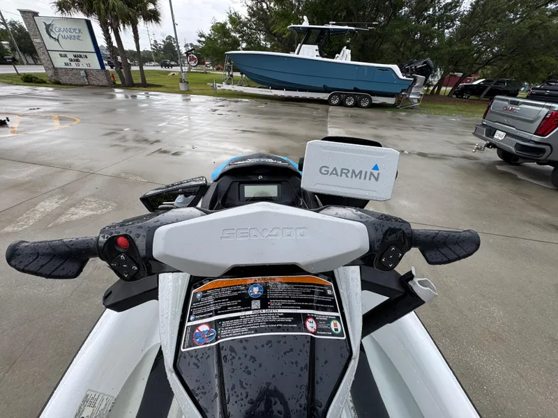 Slide: The Image of 2022 Sea-Doo Fish Pro Scout with Garmin GPS, parked on wet pavement. - 14