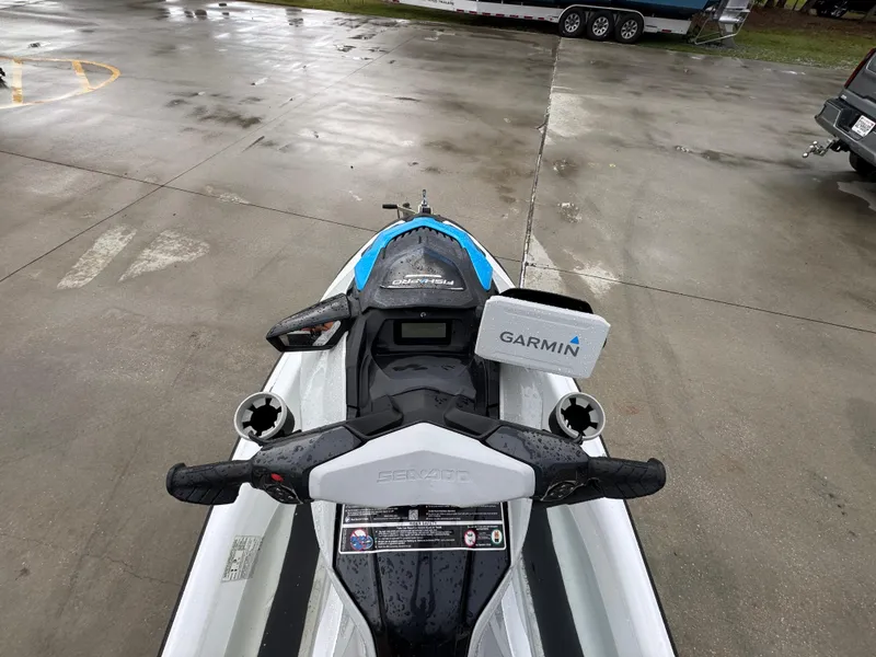 Slide: The Image of 2022 Sea-Doo Fish Pro Scout with Garmin GPS on wet pavement. - 16