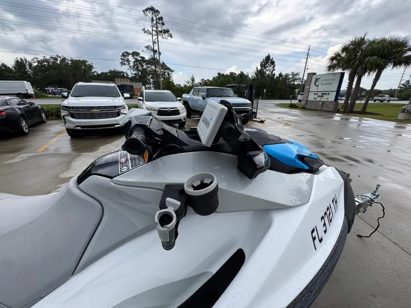 Slide: The Image of 2022 Sea-Doo Fish Pro Scout parked in a lot, surrounded by vehicles. - 23