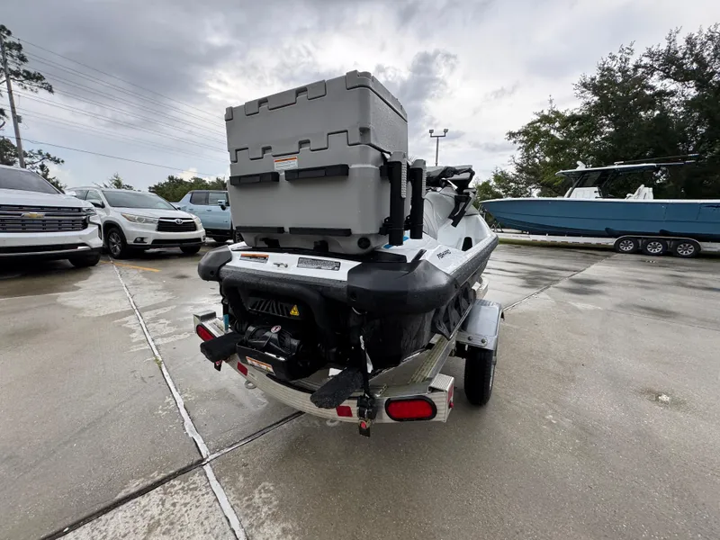 Slide: The Image of 2022 Sea-Doo Fish Pro Scout on trailer, parked outdoors on a cloudy day. - 9