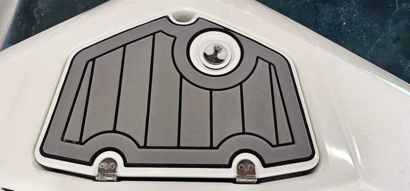 Slide: The Image of 2018 Yamaha Boats 210 FSH Deluxe deck hatch with sleek design and secure latch. - 10