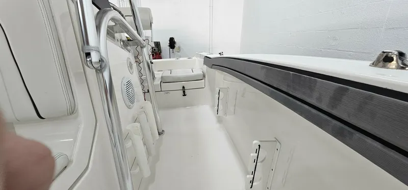 Slide: The Image of 2018 Yamaha Boats 210 FSH Deluxe interior, showcasing sleek design and spacious layout. - 19