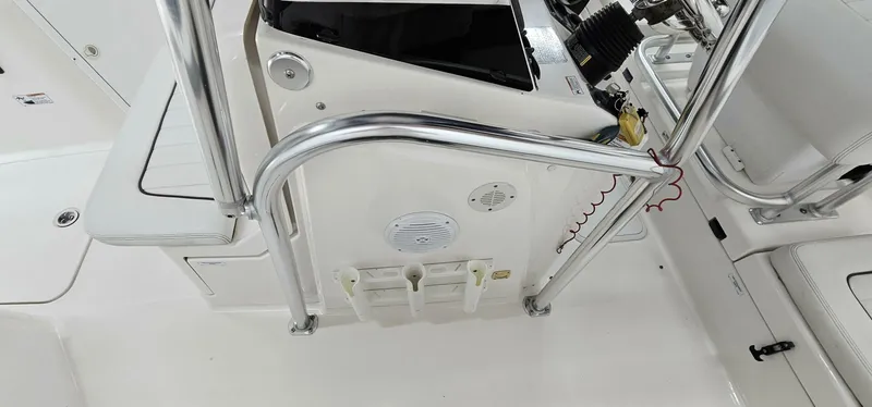 Slide: The Image of 2018 Yamaha Boats 210 FSH Deluxe interior, featuring control panel and seating area. - 20