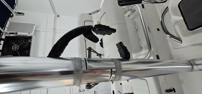 Slide: The Image of 2018 Yamaha Boats 210 FSH Deluxe interior with chrome details and wiring. - 35