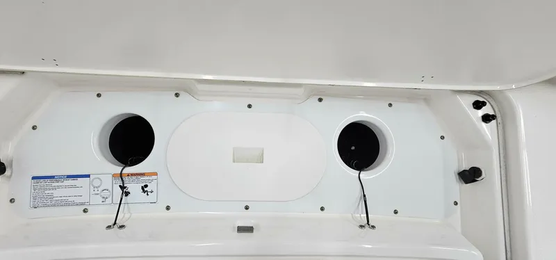 Slide: The Image of 2018 Yamaha Boats 210 FSH Deluxe dashboard with speaker mounts and control panel. - 38