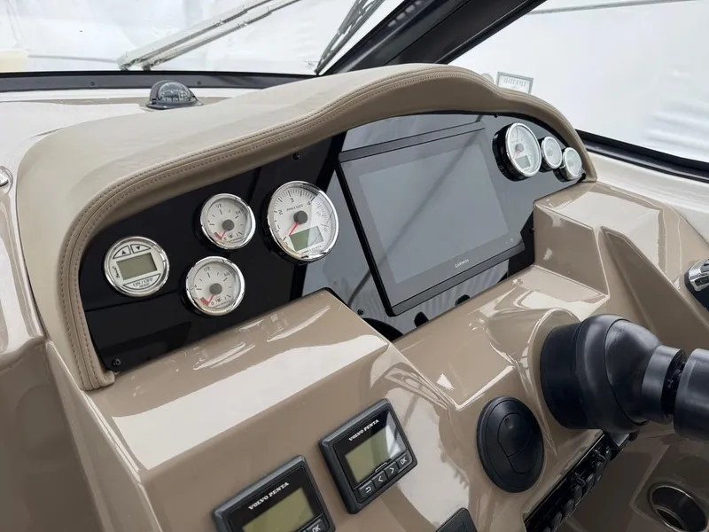 Slide: The Image of 2016 Regal 35 Sport Coupe dashboard with gauges and touchscreen display. - 6