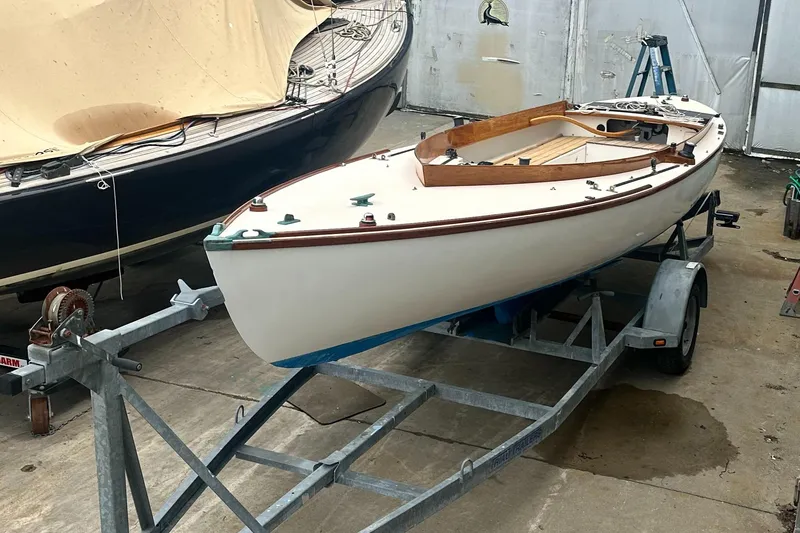 Slide: The Image of Custom Sakonnet 23 sailboat from 2004 on a trailer in a workshop. - 12