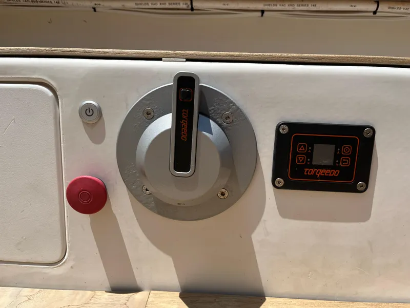 Slide: The Image of Control panel of a 2004 Custom Sakonnet 23 boat with Torqeedo throttle and display. - 14
