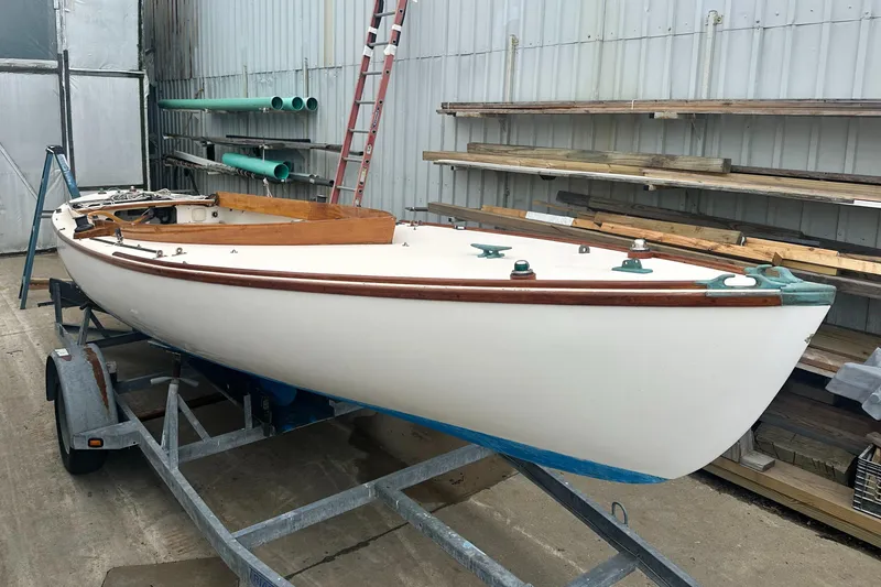 Slide: The Image of Custom Sakonnet 23 sailboat from 2004 on a trailer in a storage area. - 7