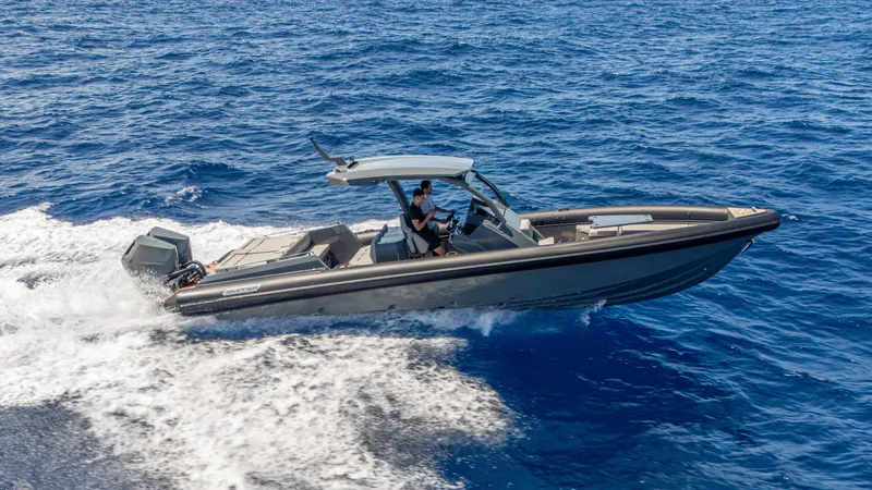 Slide: The Image of 2025 Skipper-BSK 38 boat cruising on open blue sea. - 14
