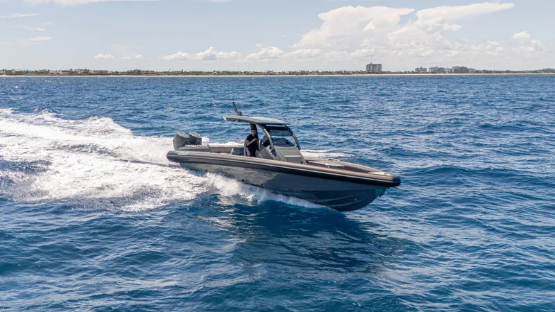 Slide: The Image of 2025 Skipper-BSK 38 boat cruising on open blue water. - 3