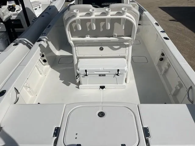 Slide: The Image of 2025 World Cat 235 CC boat interior with seating and storage compartments. - 3