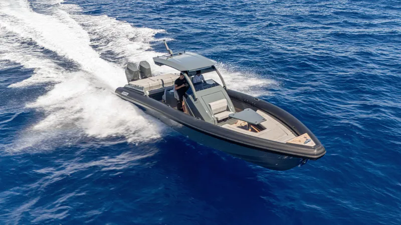 Slide: The Image of 2025 Skipper-BSK 38 boat cruising on open blue sea, showcasing sleek design and powerful performance. - 19